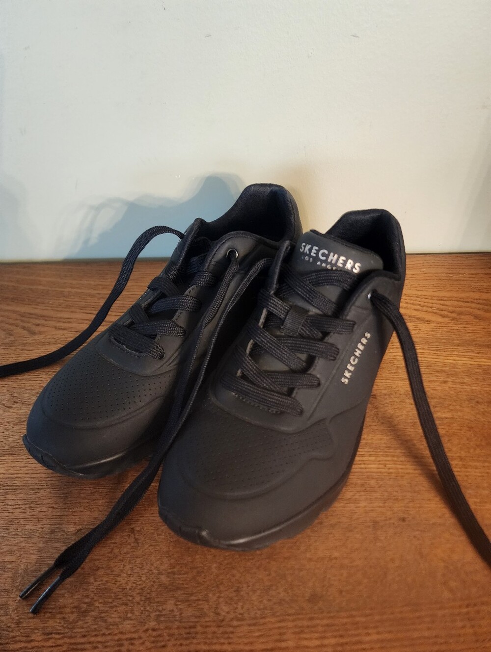 Women's Skechers Air-cooled Memory Foam All Black Sneakers.